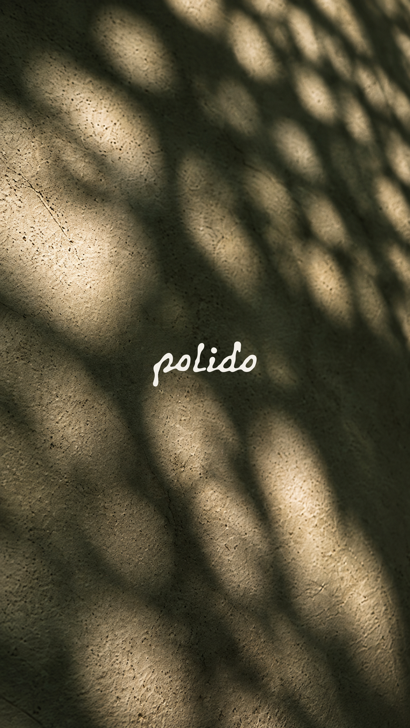 POLIDO cream signature over a textured basil surface and soft natural shadows